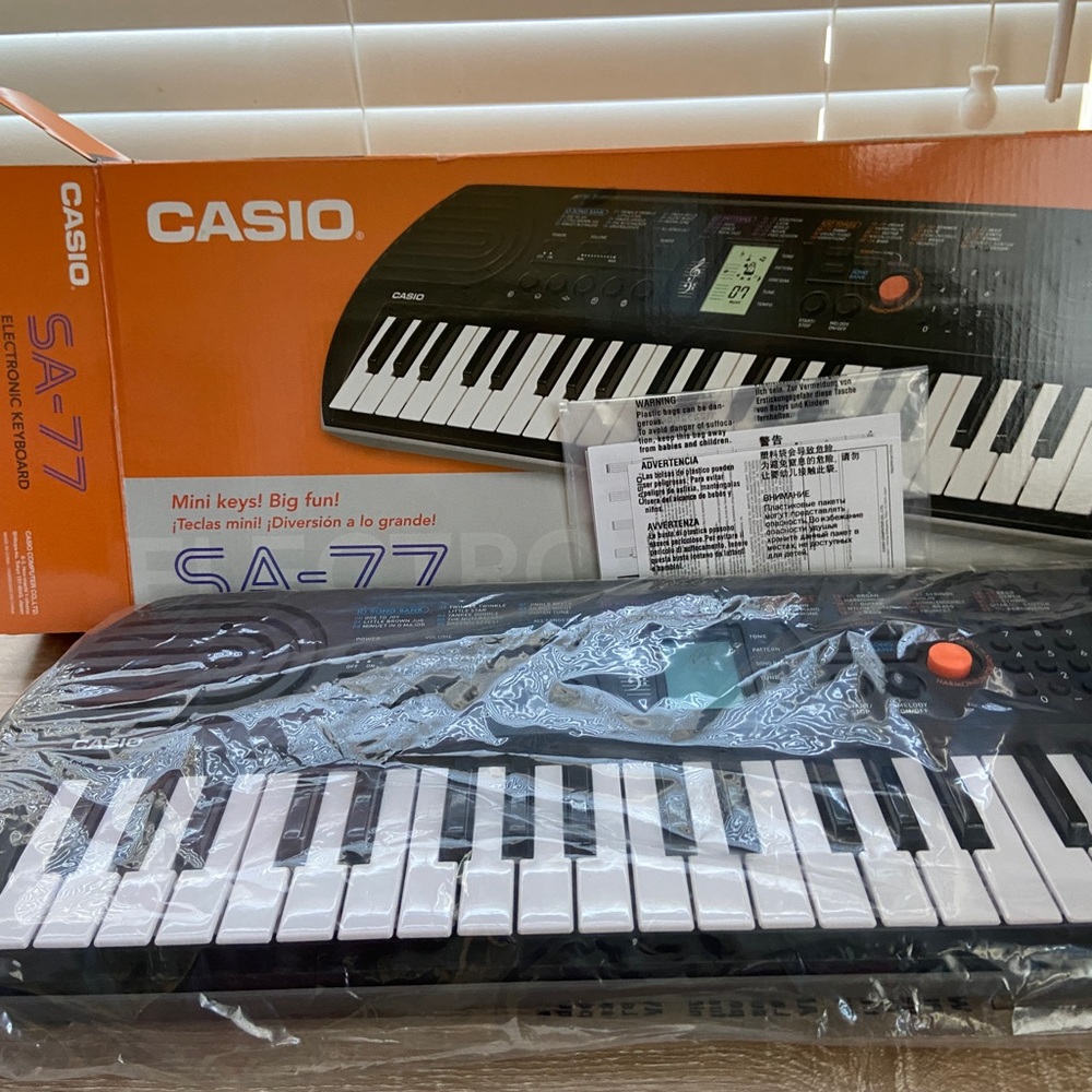 Casio SA-77 44 Key Mini Personal Keyboard - 100 Tones and 50 Rhythms